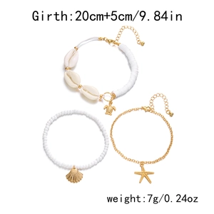 Set of three bohemian anklets with starfish, turtle charms and shells on white background