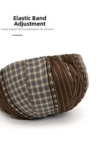 Detail of adjustable elastic band on back of two-tone vintage brown newsboy hat