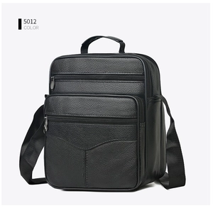 Black pebbled leather crossbody bag for men with multiple zipper compartments and handle
