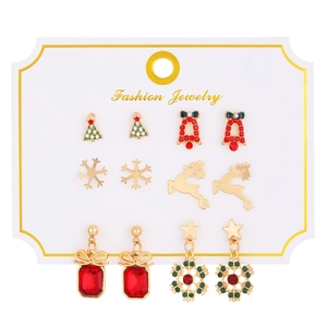 Detailed set of six Christmas earrings featuring reindeer, snowflakes, and festive charms