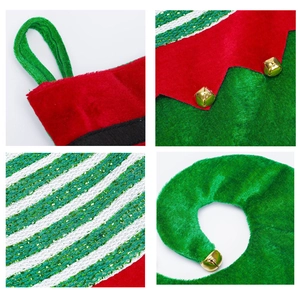 Detail view of festive velvet Christmas stockings with glitter stripes and gold bells