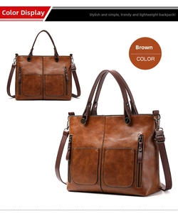 Detail view of large brown PU leather tote bag with front decorative zip pockets