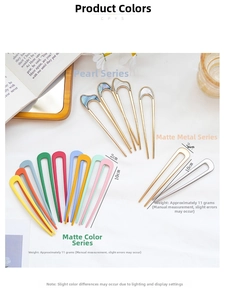 Macro detail of various U-shaped metal hair pins in matte and shell finishes