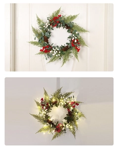 Detail of Christmas wreath with pine cones and red berries showing LED light contrast