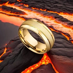 Detail of matte gold titanium ring with polished edges against lava background