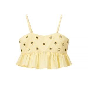 Detail view of yellow camisole featuring mirror embroidery and ruffled hem