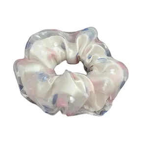 Elegant cream white scrunchie with pink floral dots and soft mesh layer for women