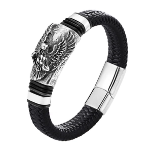 Detailed close-up of eagle head charm on black braided leather punk bracelet for men