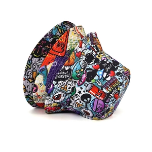Detailed close-up of double-sided bucket hats with vibrant graffiti and cartoon patterns