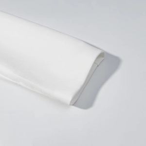 Close-up of white blazer dress cuffs showing premium textured fabric and fine stitching