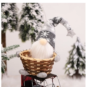 Close-up of a grey Christmas gnome in a woven bamboo basket with festive snow decor