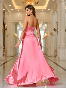Pink satin backless off-shoulder evening maxi dress with long train in a grand hallway