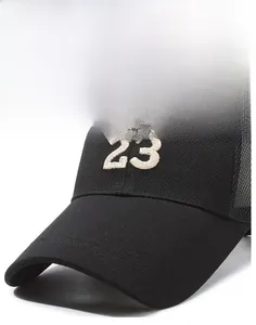 Detailed view of the 23 embroidery and breathable mesh back on this black truck cap