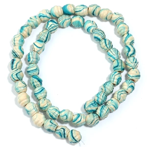 Macro detail of blue and white marble pattern wooden beads for DIY jewelry making