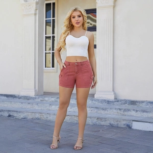 High-waist brick red cargo denim shorts paired with white ribbed knit crop top