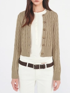 Detail of cable knit pattern on women's khaki cardigan with amber texture buttons