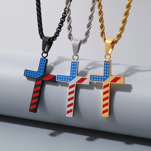 Detailed close-up of American flag cross pendants in black, silver and gold finishes