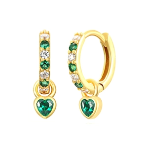 Detail of golden huggie earrings with green zircon pave and heart shaped gemstone drops