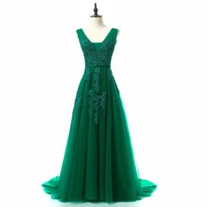 Detail of forest green V-neck evening gown with floral lace embroidery and tulle mesh