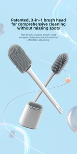 Detail of 3-in-1 TPR toilet brush head with gray silicone bristles and scraper functionality
