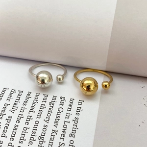 S925 sterling silver minimalist open rings with gold and silver beads on book pages