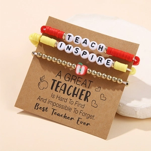 Detail view of 3-piece teacher gift bracelet set with apple charm and inspiration cards
