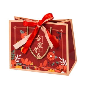 Red Chinese wedding gift bag with Wu Jia You Xi print, gold rope handle and ribbon