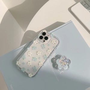 Detail of floral iPhone case with matching liquid glitter flower-shaped phone stand