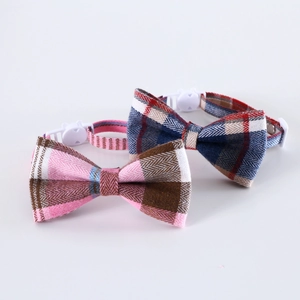 Detail of adjustable plaid pet collars with plastic safety buckles and bowties
