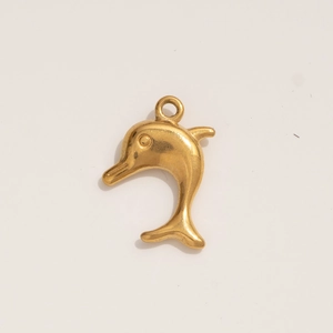 Detail of a golden dolphin-shaped stainless steel pendant with a polished metallic finish
