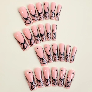 Pink French coffin fake nails with black abstract 3D line textures and rhinestones
