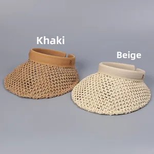 Detail of hand-woven hollow straw sun hats in khaki and beige with R logo embroidery