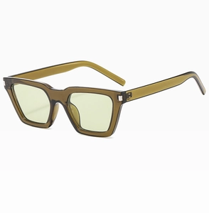 Detail view of square olive green semi-transparent sunglasses with metal hinges