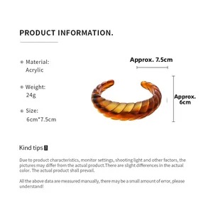 Detail view of amber acrylic twisted cuff bangle with specific dimensions and weight