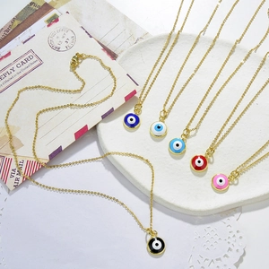 Bohemian gold plated evil eye pendant necklaces in six colors on decorative mail background