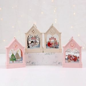 Detailed view of Christmas hanging lanterns with Santa and Snowman graphics on a base