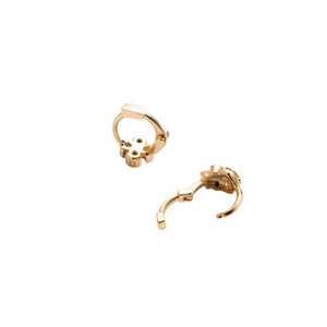 Elegant gold clover hoop earrings with sparkling zircon inlay on polished metal surface