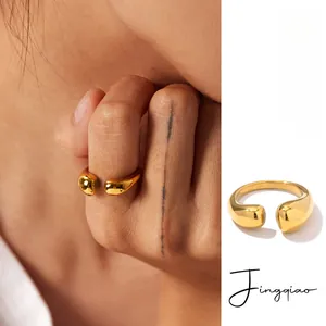 Detail view of oval hollow 18K gold PVD plated stainless steel open ring for women