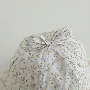Floral baby sun hat with bow detail and vintage lace edges for girls in summer