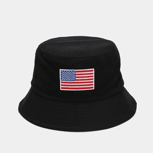 Detail of USA flag embroidery on black cotton bucket hat with premium stitching