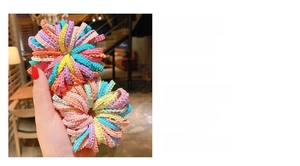 Detail view of 50-pack colorful seamless nylon hair ties with handmade lace texture