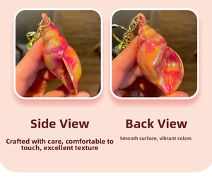 Macro detail of colorful shell keychain showing vibrant swirl patterns and golden clasp