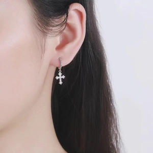 S925 sterling silver hoop earrings with a micro-pave zircon cross pendant on ear