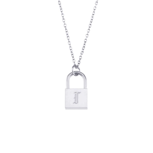 Macro detail of silver lock pendant necklace featuring engraved letter T on stainless steel