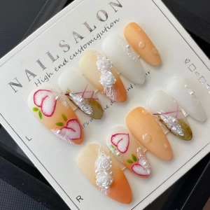 Handmade press-on nails with 3D embossed roses and orange gradient finish