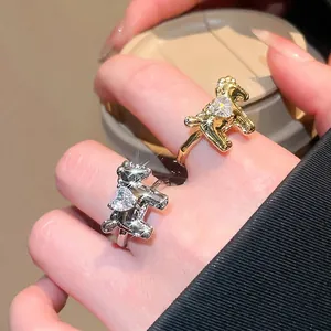 Elegant gold and silver pony rings with heart zircon, worn by model for a luxury daily look