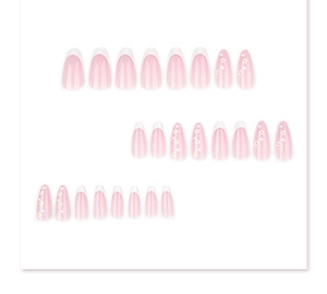 Flat lay of 24pcs pink almond press-on nails with white French tips and flower patterns