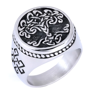 Macro shot of silver Tree of Life engraving and Celtic patterns on stainless steel ring