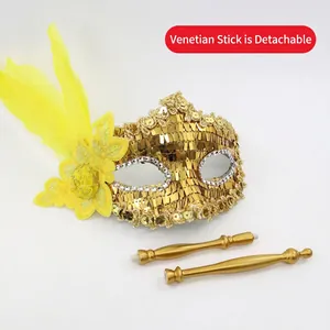Golden sequin Venetian masquerade mask with yellow feathers and detachable handheld stick