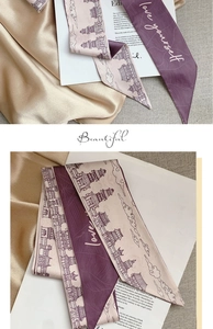 Detail of silk hair scarf featuring vintage architecture patterns and elegant lettering